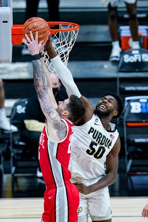 Ohio State forward Kyle Young, here getting his shot blocked by Purdue's Trevion Williams, has missed the past two games.