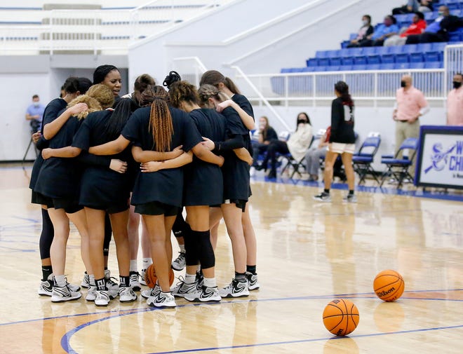 The Norman girls basketball team gathers before their playoff game in Sapulpa on Friday afternoon. [Sarah Phipps/The Oklahoman]