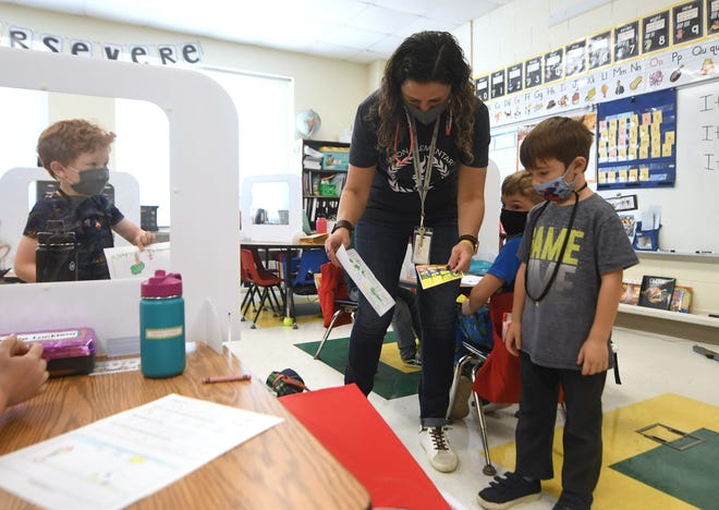 In this StarNews file photo, Eaton Elementary kindergarten teacher Vanessa DeSelms works with kids during class at the school in Wilmington, N.C., Friday, March 12, 2021.