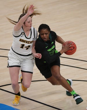Michigan State guard Janai Crooms (23) drives against Iowa guard McKenna Warnock (14) during the Big Ten tournament Friday, March 12, 2021, at Bankers Life Fieldhouse in Indianapolis.