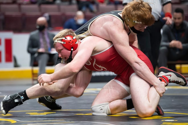 Freedom Area's Trent Schultheis, bottom, wrestles Halifax's Bryce Enders in a 189-pound quarterfinal bout at the PIAA Class 2A wrestling championship at the Giant Center in Hershey on Friday, March 12, 2021. Schultheis won by decision, 5-3.