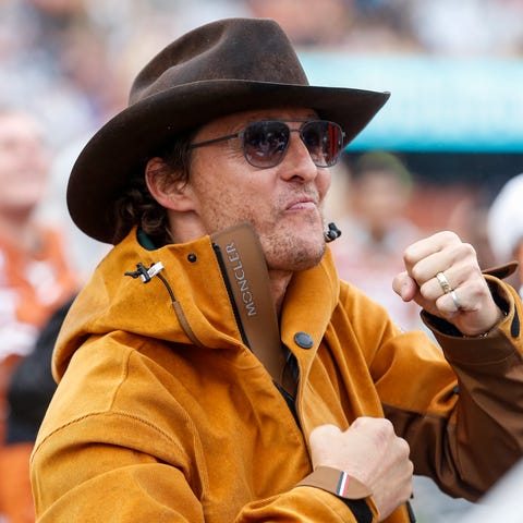 Matthew McConaughey celebrates on the Texas Longho