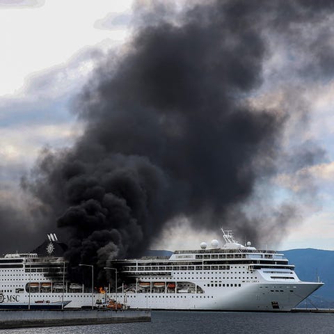 Cruiser MSC Lirica is pictured on fire, while dock