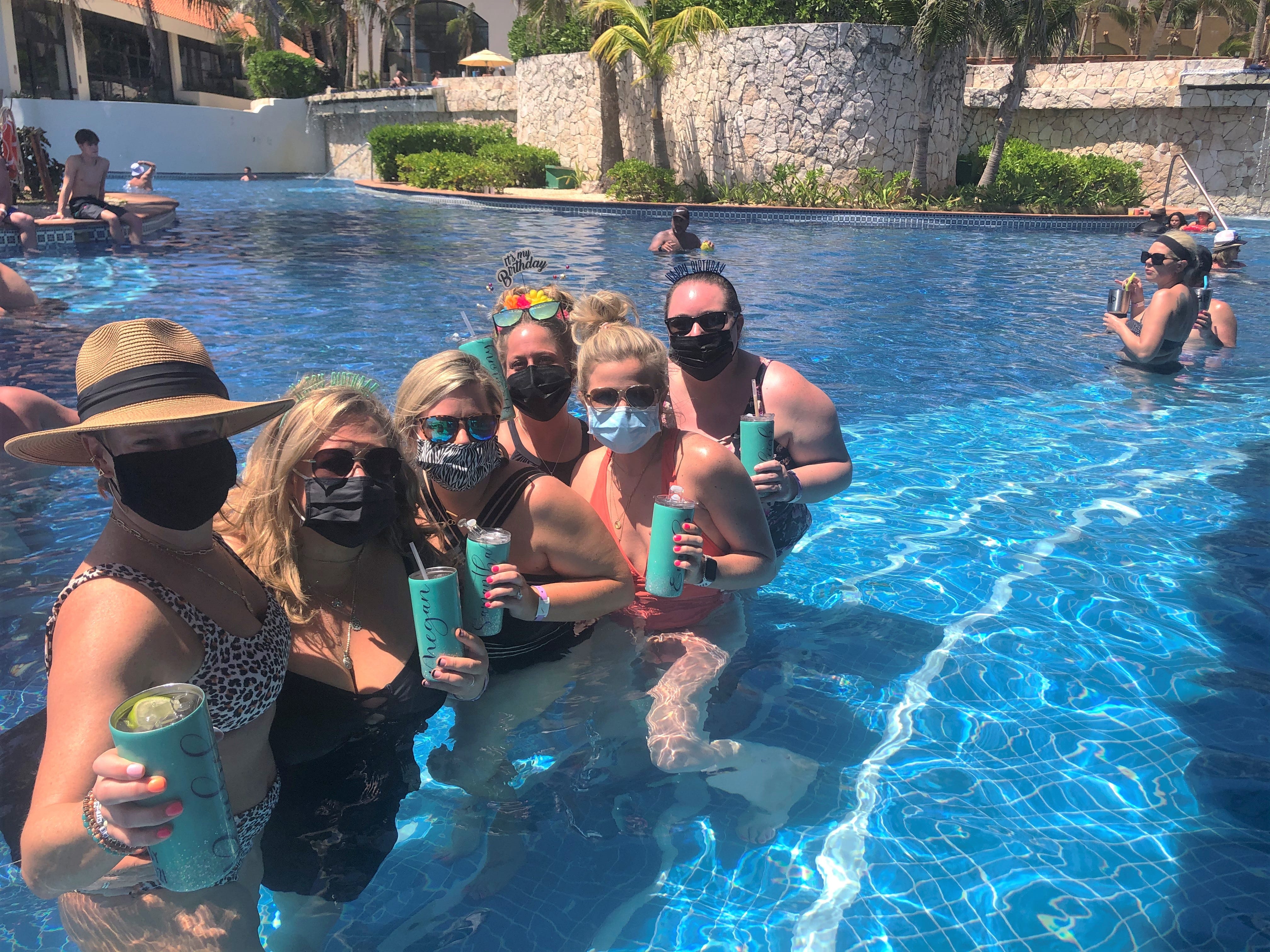 A group of friends from the Midwest flew to Cancun to celebrate the 40th birthday of Harmony Godsey, who sported a flowery birthday tiara, third from right.