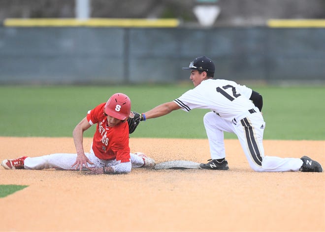 Abilene High second baseman Diego Flores tags out Sweetwater's Darian Carr on a steal attempt at the Abilene ISD Invitational last season at Blackburn Field in Abilene.