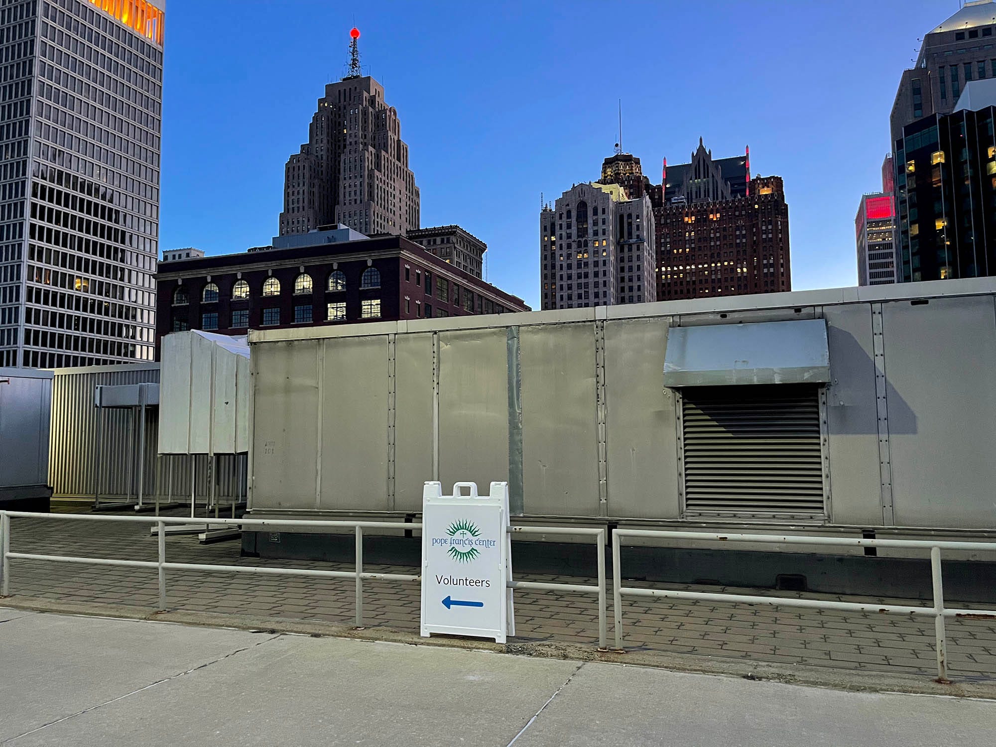 Pope Francis Center volunteers who show up at TCF Center on March 6, 2021, to work the 7 a.m. meal shift park on the roof of the building and follow the sign directions.