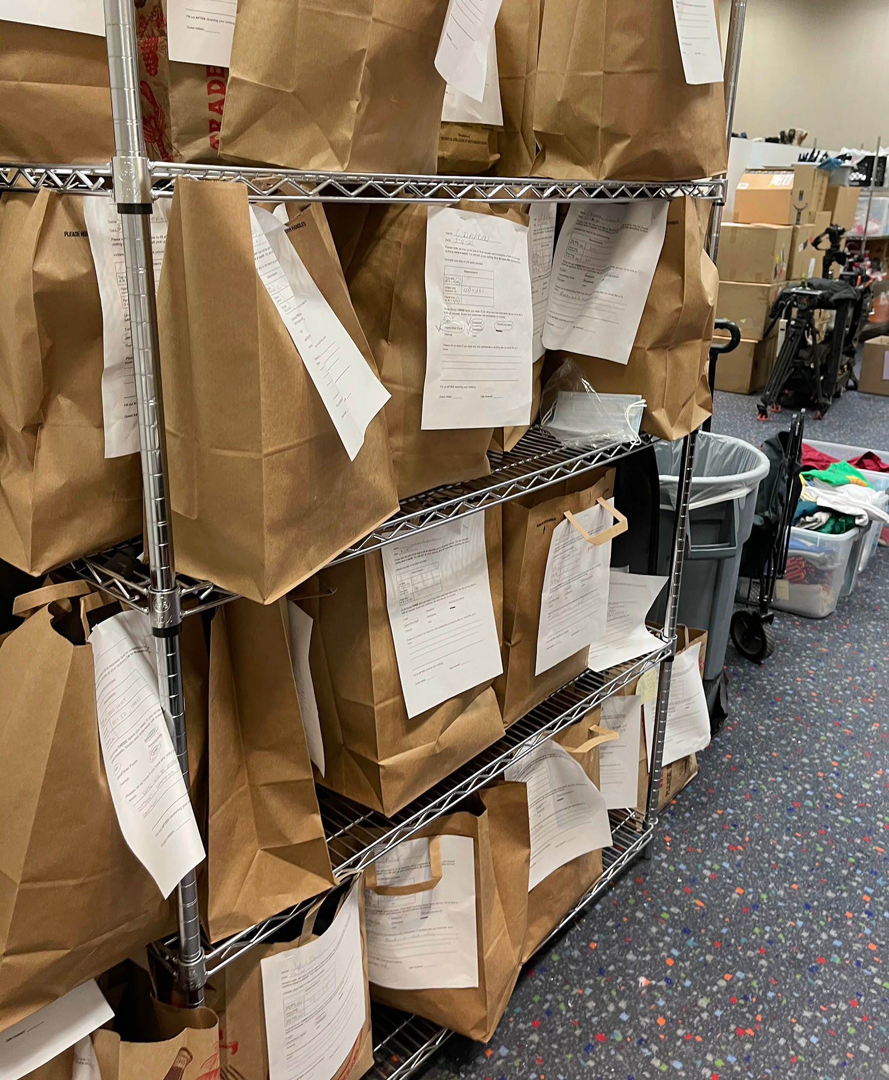 These paper bags stacked up in a supply room run by the Pope Francis Center at TCF contain articles of donated clothing such as underwear, socks, belts and pants that are given out to homeless people who have previously put in orders.