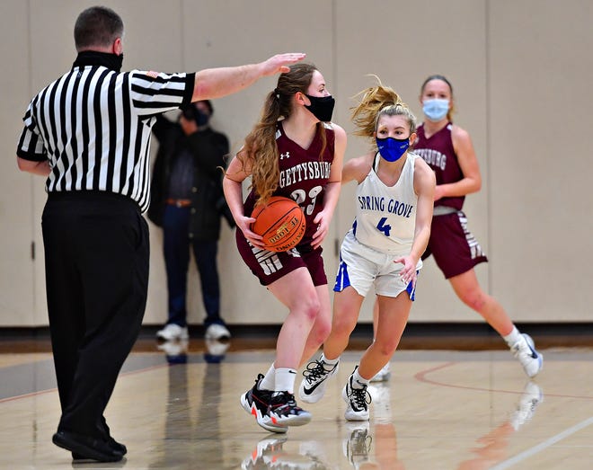 An official is shown here in action during a York-Adams girls' basketball game. The local basketball officials will determine the winners of the Gretchen Wolf Swartz Sportsmanship Awards. Last season, $110,000 in scholarships were awarded to area seniors.