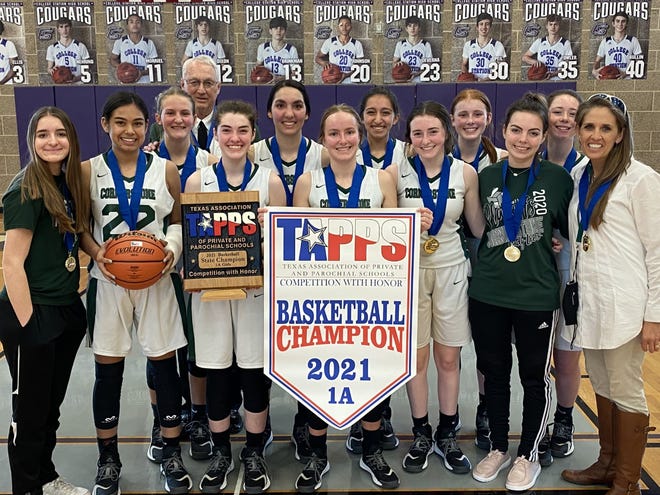 The San Angelo Cornerstone Christian School girls basketball team poses with its TAPPS Class 1A state championship trophy Saturday, March 13, 2021, in College Station, Texas.