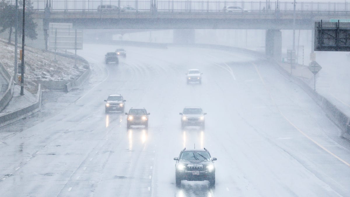 Cars drive along I-25 as it starts to snow on March 13, 2021 in Denver, Colorado. According to the National Weather Service, the weekend storm is expected to bring up to two feet of snow to the Denver area and two to four feet of snow to areas in the foothills.
