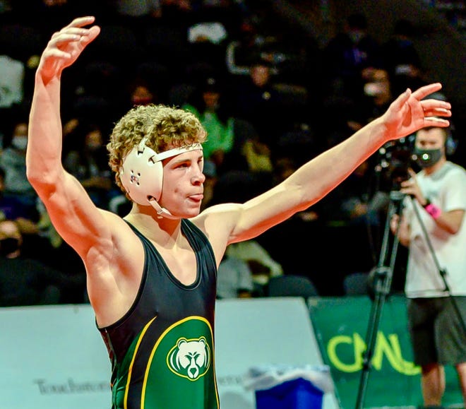 Rock Bridge's Carter McCallister celebrates after winning the 126-pound championship in the Class 4 state wrestling tournament Saturday at Cable Dahmer Arena in Independence.