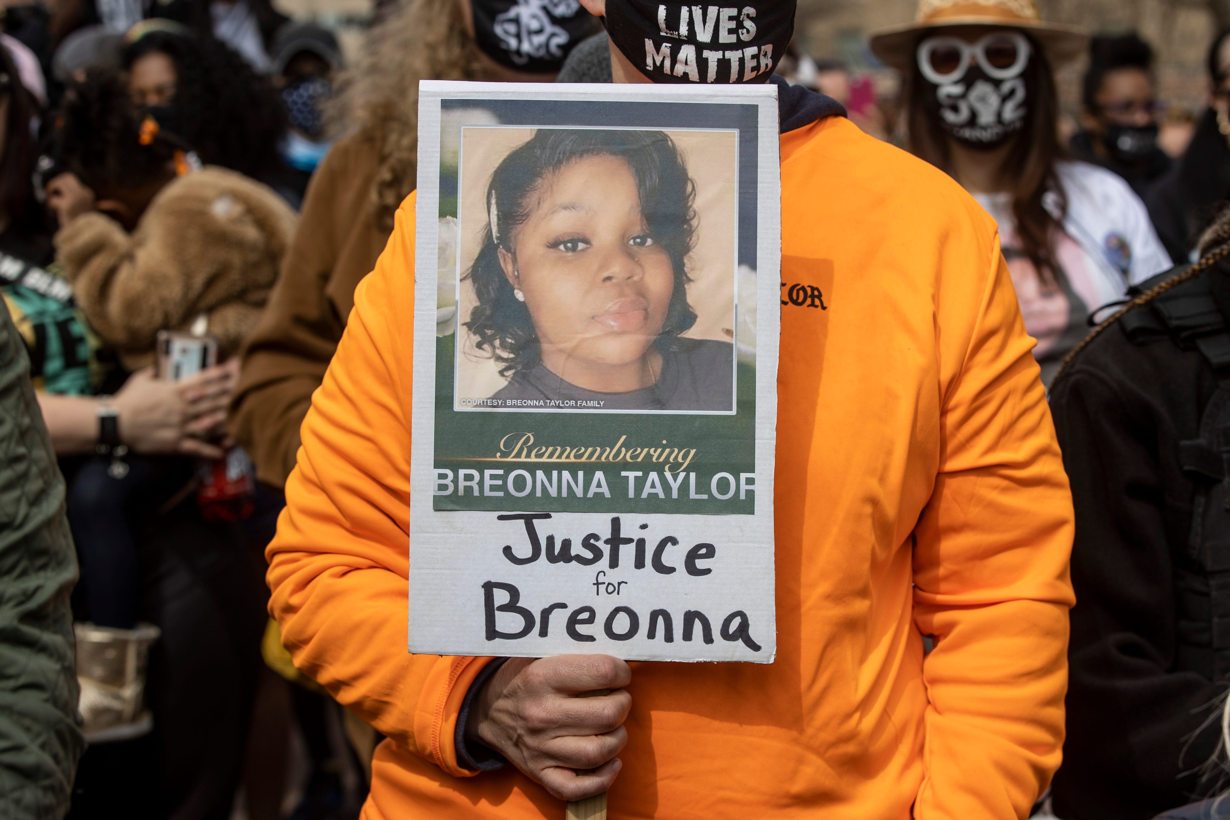 A sign for Breonna Taylor is held during a protest in Louisville on March 13, 2021.