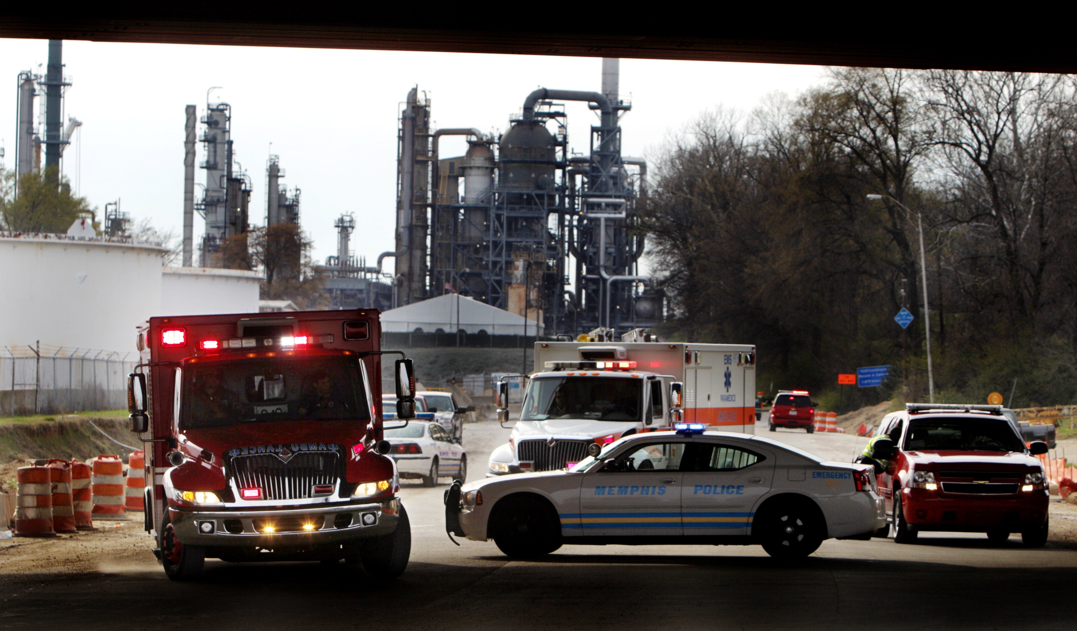 March 6, 2012 -  A pair of ambulances pull out of the Valero oil refinery on Mallory following an explosion at the plant that critically injured three people. Vapors at the plant ignited, seriously burning three men, MFD officials said.