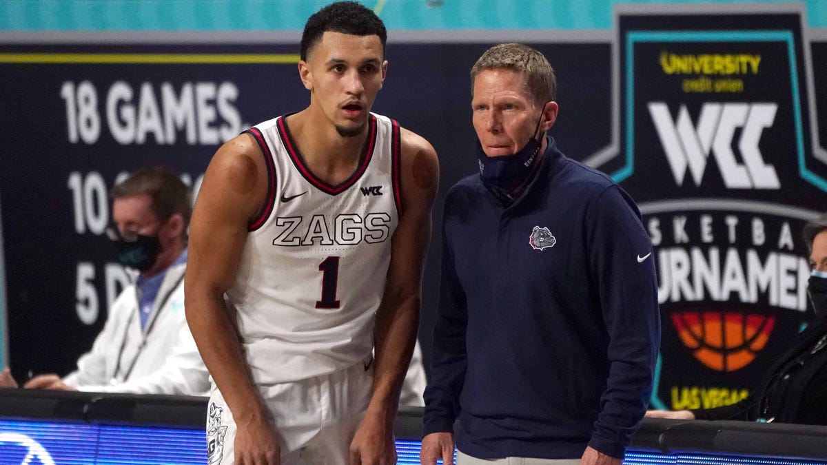 Gonzaga Bulldogs guard Jalen Suggs (1) and head coach Mark Few (R) react during the second half of the West Coast Conference Tournament championship game against the BYU Cougars at Orleans Arena.