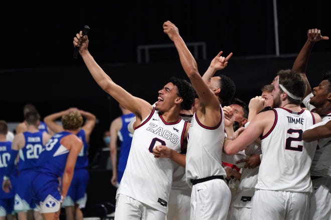 Gonzaga players celebrate after defeating Brigham Young in the West Coast Conference tournament championship game at Orleans Arena.