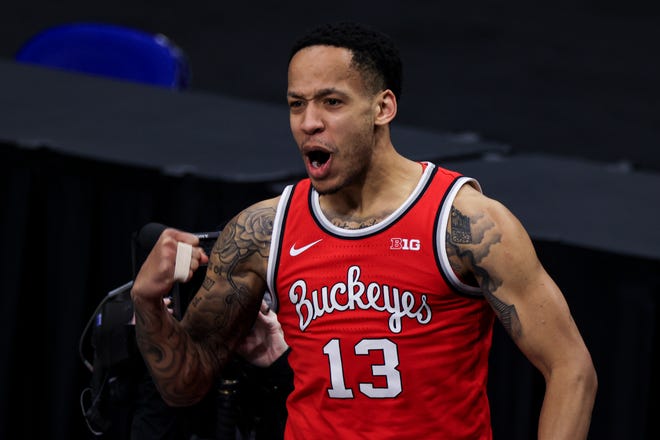 Mar 14, 2021; Indianapolis, Indiana, USA; Ohio State Buckeyes guard CJ Walker (13) reacts after making a basket while being fouled in the game against the Illinois Fighting Illini in the second half at Lucas Oil Stadium. Mandatory Credit: Aaron Doster-USA TODAY Sports