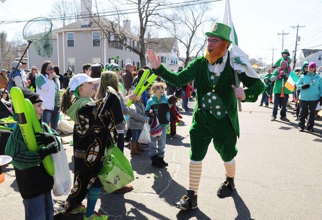 Paul Hagerty, of Abington, greets some admirers during the 35th annual St. Patrick's Day Parade in Abington on Sunday, March 17, 2014.