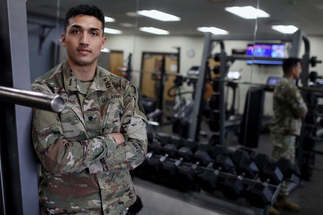 Specialist Rodrigo Ramos, a member of the 831st Engineer Company with the Iowa National Guard, is shown Monday in the weight room of the Armed Forces Reserve Center in Middletown. Specialist Ramos along with National Guard recruits is leading free, indoor, and outdoor Middletown Weekly Workouts from 5:30 to 6:30 p.m. Thursdays at the Armed Forces Reserve Center in Middletown.