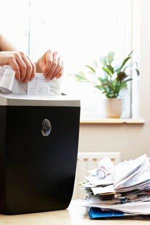 Shredding paper is one way to get the clutter out of your home.