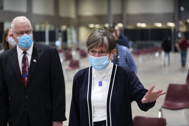 Gov. Laura Kelly and KDHE Secretary Lee Norman tour a COVID-19 vaccine administration site Monday at the Stormont Vail Events Center in Topeka.