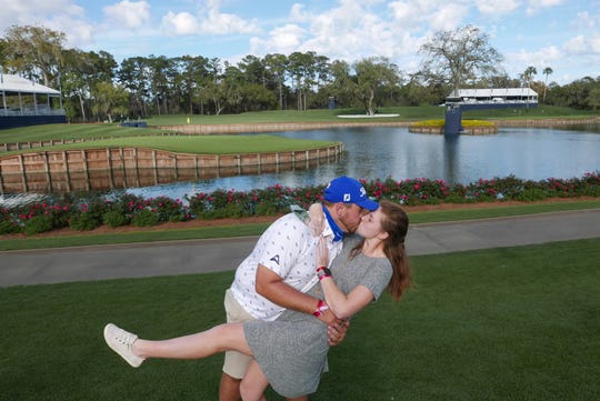 St. John Neumann High School and North Florida graduate Sydney Shrader kisses her fiancee, Mike Mattiace, after he proposed to her on the tee of the iconic 17th hole at TPC Sawgrass during the pro-am of The Players Championship on Wednesday, March 9, 2021.