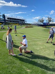 Mike Mattiace proposes to St. John Neumann High School and North Florida graduate Sydney Shrader on the tee of the iconic 17th hole at TPC Sawgrass during the pro-am of The Players Championship on Wednesday, March 9, 2021.