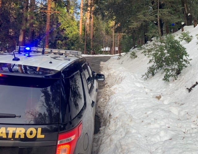 This photo shows a California Highway Patrol unit at the scene of a collision involving a 7-year-old boy on Sylvan Way in Pine Cove. The child died Sunday, March 14, 2021 after sledding into the path of a moving vehicle.
