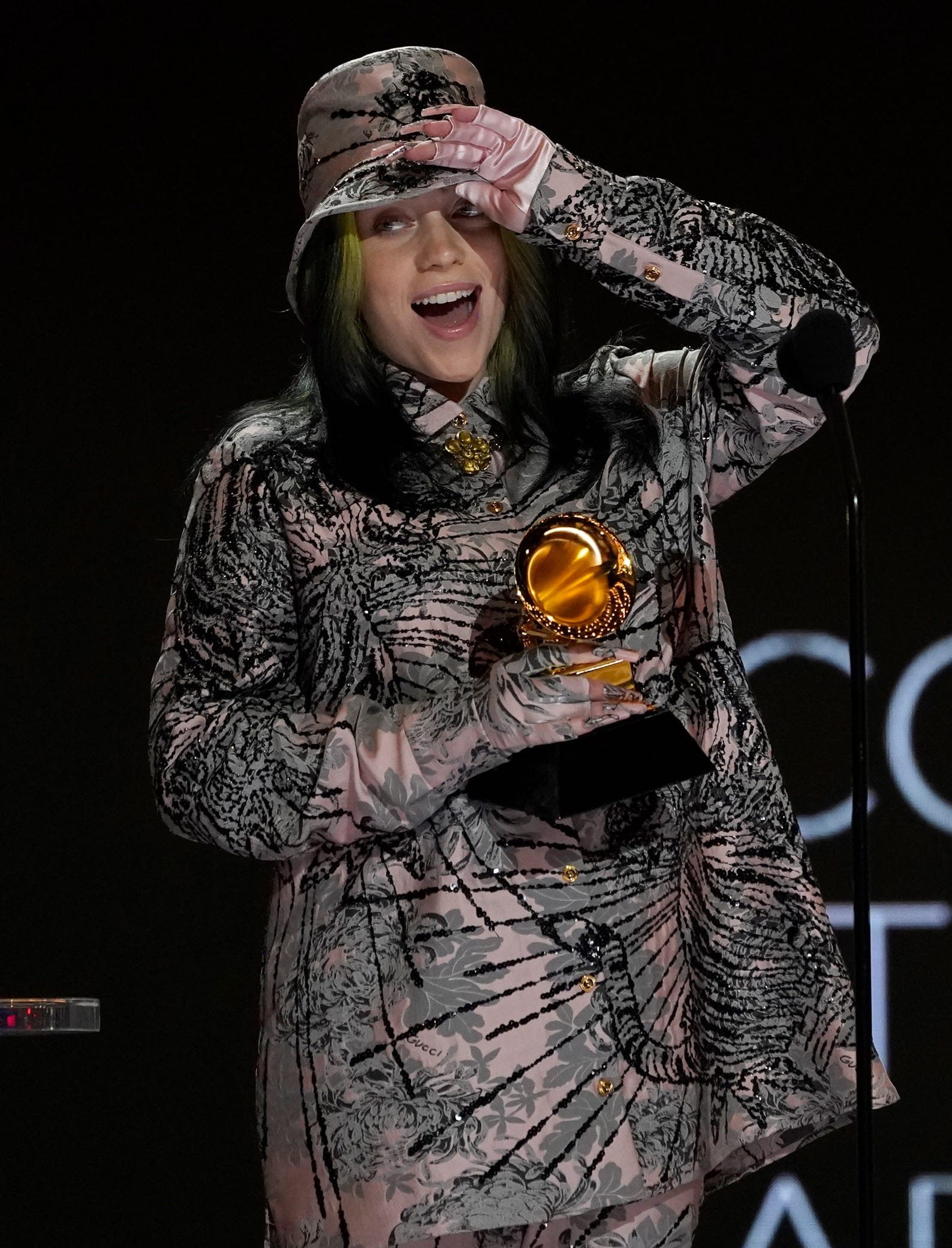 Billie Eilish reacts as she accepts the award for record of the year for