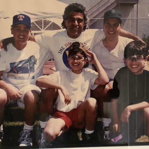 Zack Minasian is shown with his boys Perry, top le