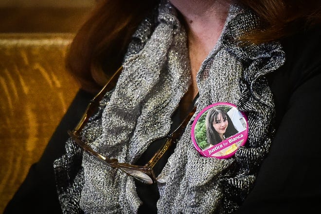 A woman wears a "Justice for Bianca" pin in the spectator area during the trial for Brandon Clark. Clark was sentenced to 25 years to life in state prison for the murder of Bianca Devins.