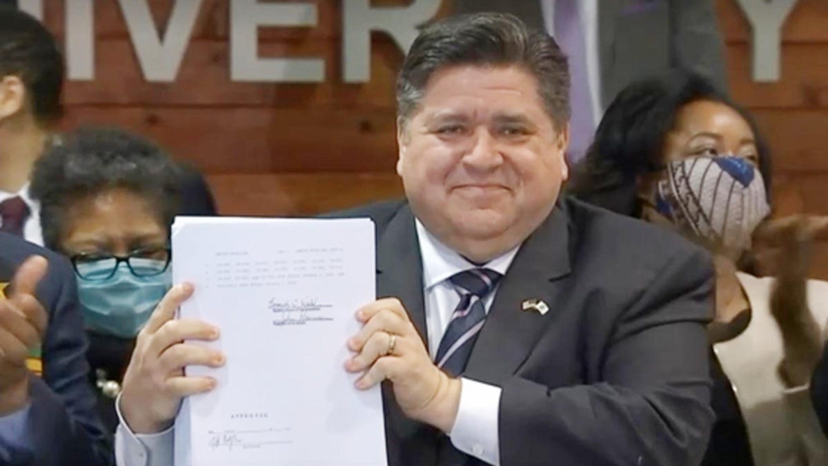Gov. JB Pritzker, shown here after signing a bill, discussed the budget for the upcoming fiscal year.