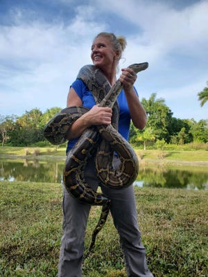 Amy Siewe, who describes herself as a python huntress, can't guarantee you'll spot a python, but the Everglades after dark is still fascinating.