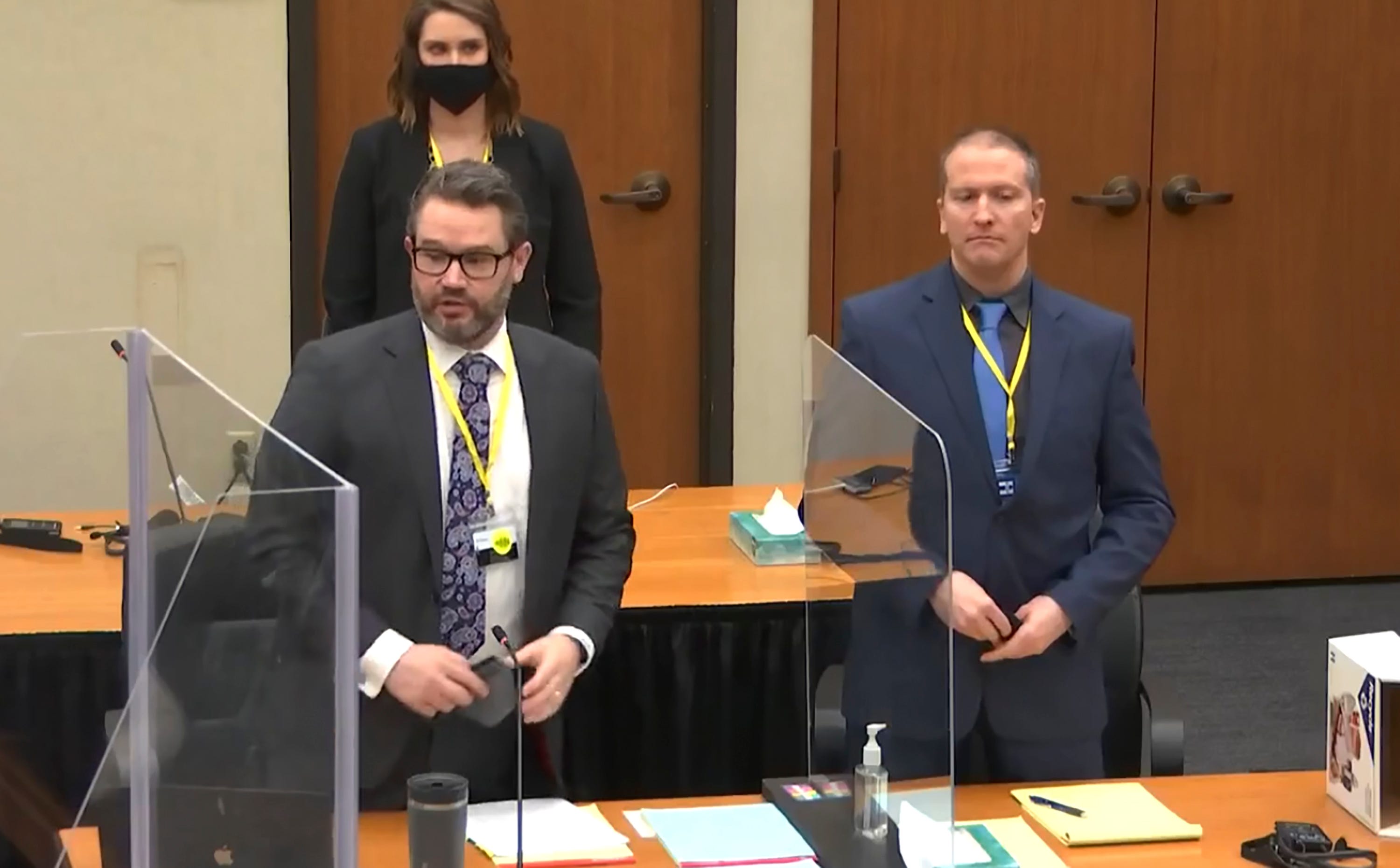 In this image taken from video, defense attorney Eric Nelson, left, and defendant former Minneapolis police officer Derek Chauvin, right, and Nelson's assistant Amy Voss, back, introduce themselves to potential jurors as Hennepin County Judge PeterÂ Cahill presides, prior to continuing jury selection, Monday, March 15, 2021, in the trial of Chauvin, at the Hennepin County Courthouse in Minneapolis, Minn. Chauvin is charged in the May 25, 2020, death of George Floyd.