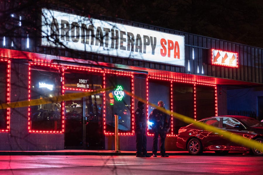 March 16, 2021: Law enforcement personnel are seen outside a massage parlor where a person was shot and killed in Atlanta, Georgia. Eight people were killed in shootings at three different spas in the US state of Georgia on March 16 and a 21-year-old male suspect was in custody, police and local media reported, though it was unclear if the attacks were related. 