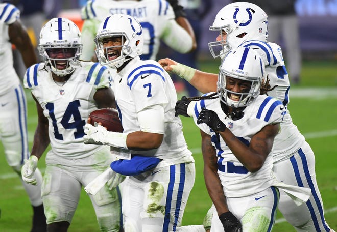 Former Indianapolis Colts quarterback Jacoby Brissett celebrates after a touchdown. [CHRISTOPHER HANEWINCKEL/USA TODAY Sports]
