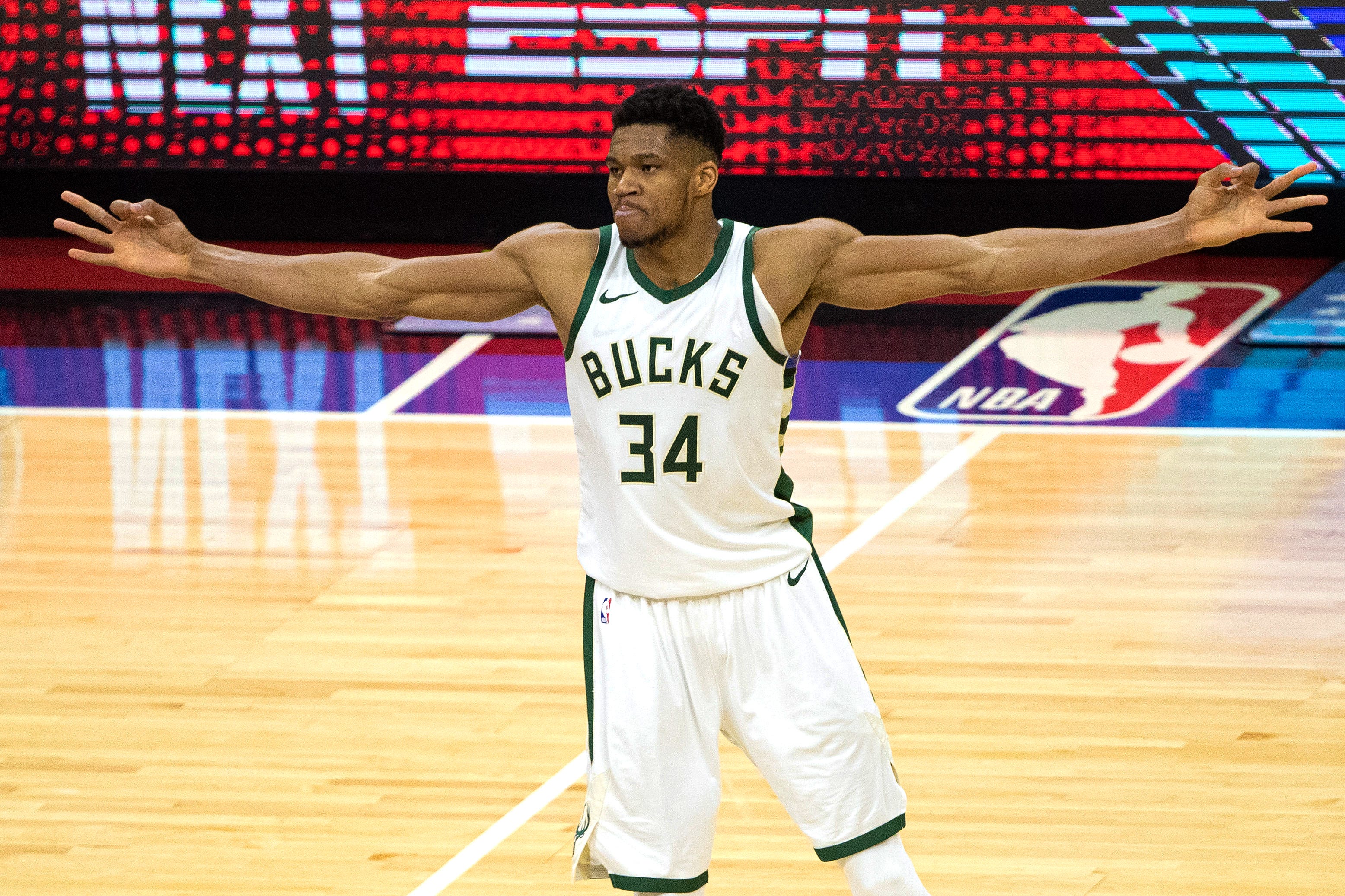 The finals mvp trophy looks comically small in giannis antetokounmpo's...