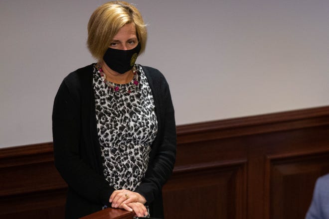 Sen. Loranne Ausley stands at her desk during a Senate session Thursday, March 18, 2021.
