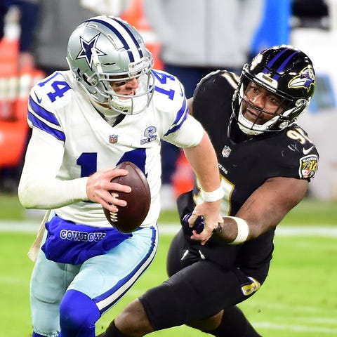 QB Andy Dalton (14) and pass rusher Yannick Ngakou
