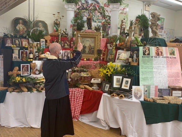In a file photo, a St. Joseph's altar is blessed by Fr. Andre Melancon of St. Bernadette Catholic Church in Houma.