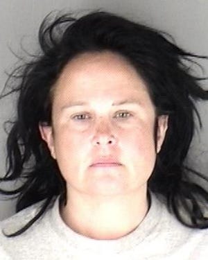 Jenny Marie Lynn, 43, was booked Thursday afternoon into the Shawnee County Jail in connection with crimes that included two counts of aggravated arson and one count of arson.