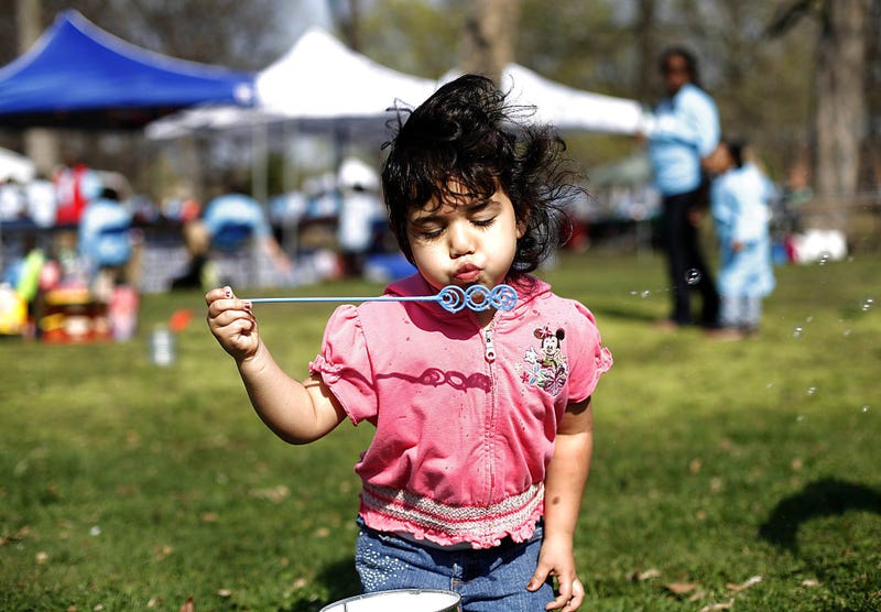 Yari Garza, 4, of Detroit, blows bubbles during the Dia de los Ninos and Dia de los Libros (The Day of Children and the day of books) event at Clark Park in Detroit, on April 25, 2009. The event features, books, reading activities, storytelling, arts and crafts and fun foods.