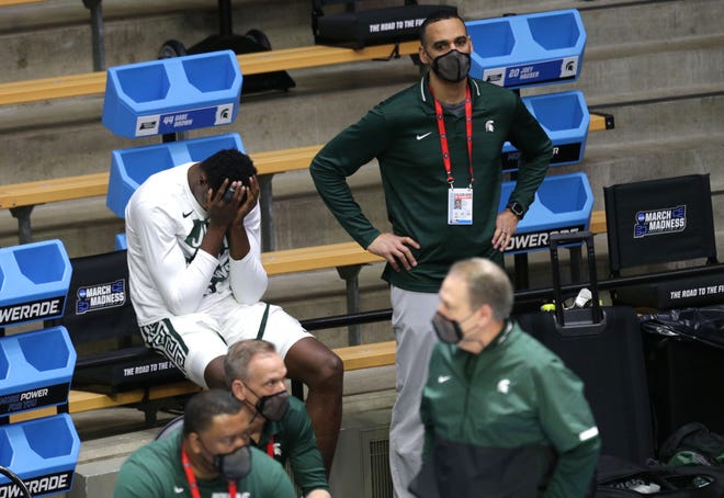 A Michigan State player hangs his head after losing to UCLA during the first round of the 2021 NCAA Tournament on Friday, March 19, 2021, at Mackey Arena in West Lafayette, Ind.