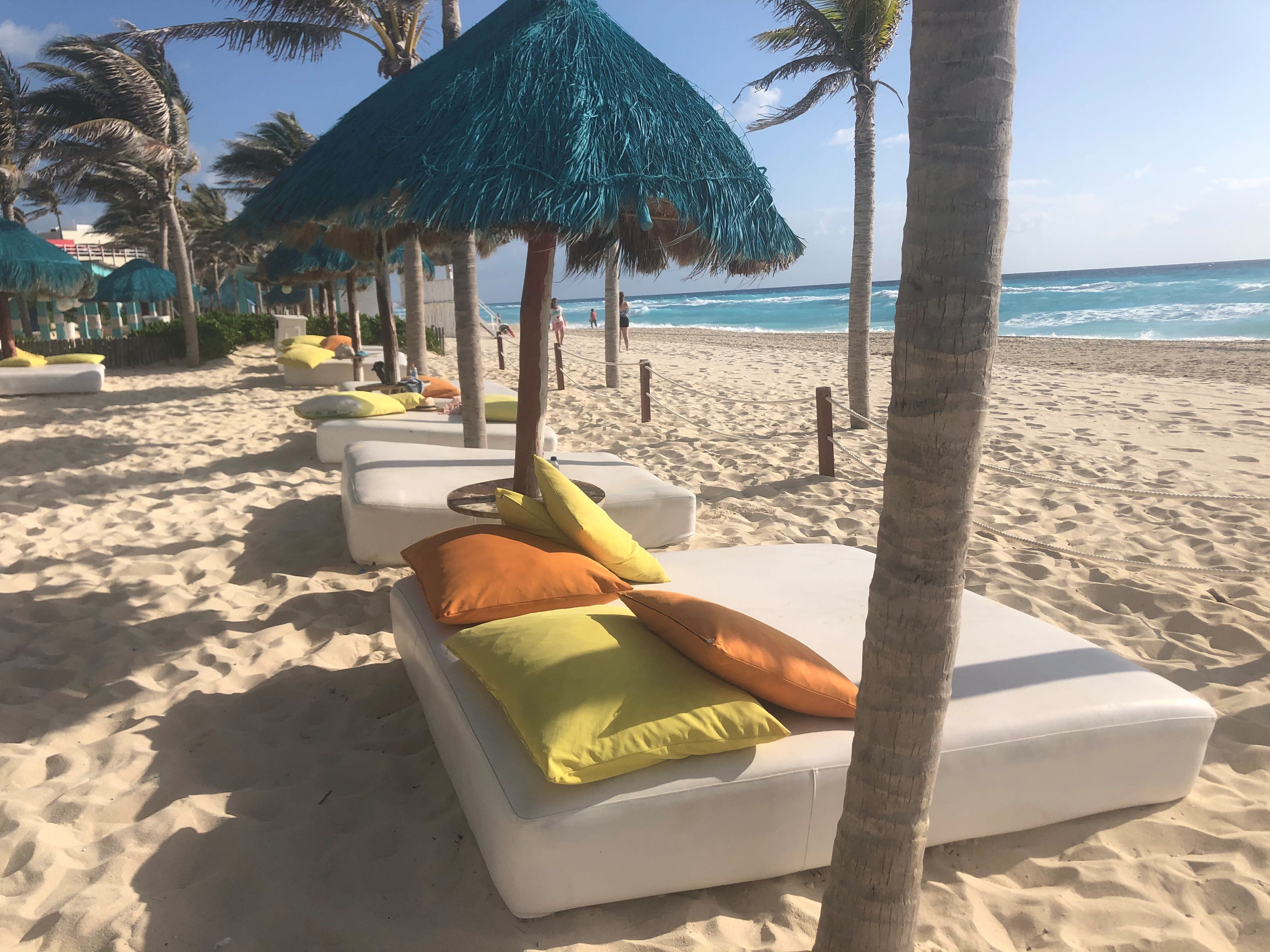 Beachfront day beds are available in Cancun, Mexico.