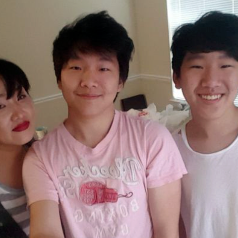 Hyun Jung Grant stands with her sons Randy Park, c