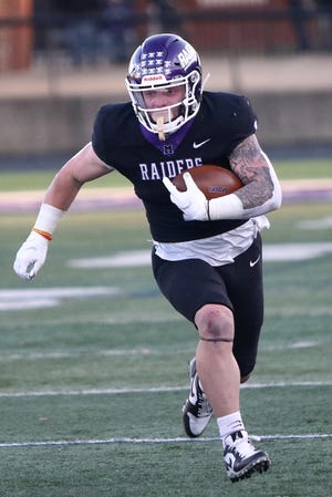 Mount Union's Josh Petruccelli runs for yardage against John Carroll during a game in March.