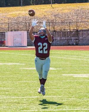 Bishop Stang's Jacob Figueiredo pulls in the interception for the Spartans.