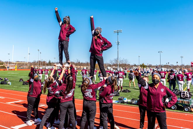 Bishop Stang's cheer squad looks to get the crowd involved.