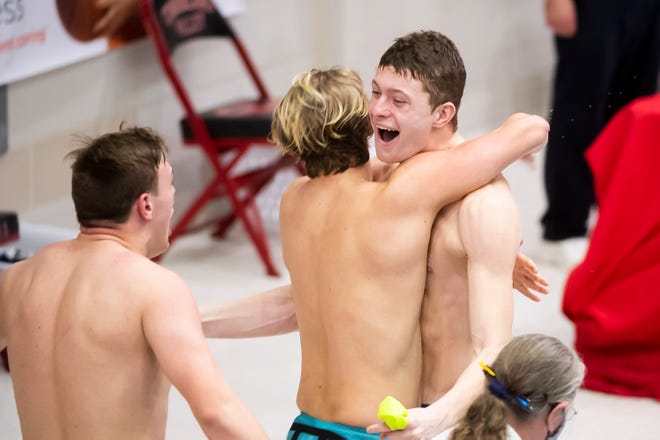Riverside's Sam Kline, Graham Kralic and Joseph Roth celebrate after winning gold in the 200 yard freestyle relay at the PIAA Class 2A Swimming Championships in Mechanicsburg, Pa., on Friday, March 19, 2021.