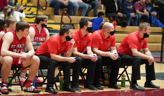 The St. Mary bench looks on during the Cardinals' Class B semifinal game against Aberdeen Christian on Friday, March 19, 2021.
