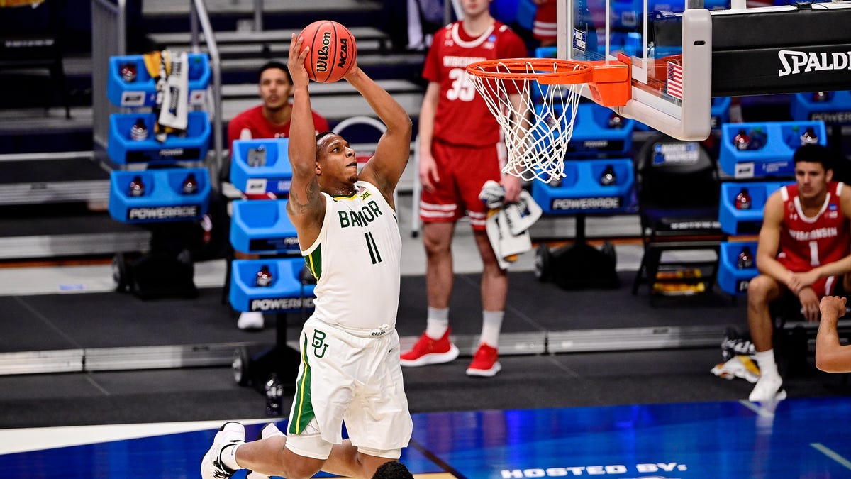 Baylor's Mark Vital (11) dunks against Wisconsin during the first half in the second round of the 2021 NCAA Tournament at Hinkle Fieldhouse.